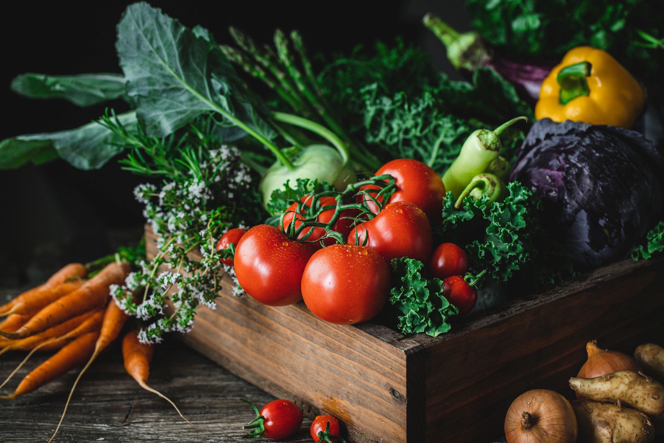 Wooden box full of fresh organic vegetables