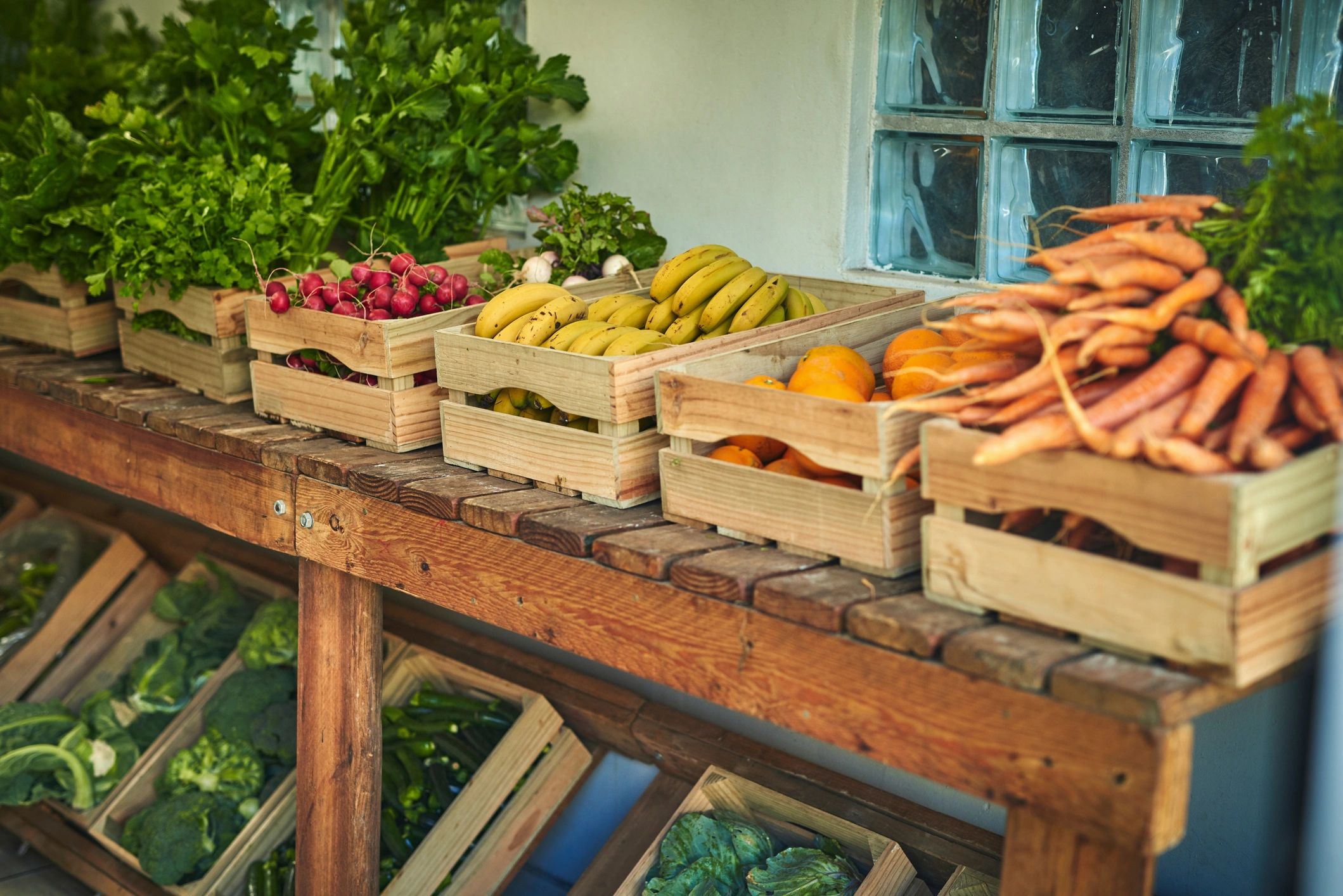Freshly picked produce in a wooden crate