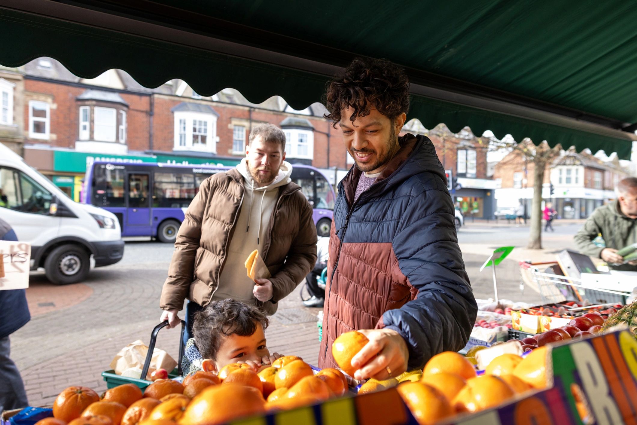 Customer shopping outside a local fruit and vegetable shop